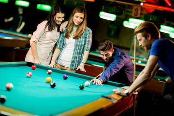 Young people playing pool