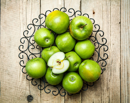 fruit. apples in a bowl on wooden background