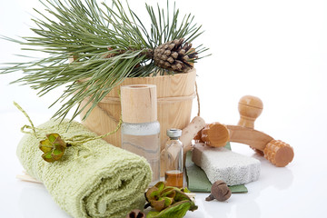 Wooden bucket with ladle for the sauna and stack of clean towels