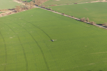 aerial view of harvest fields with tractor