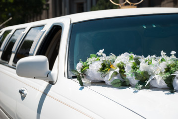 White wedding car with flowers