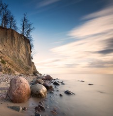 Beautiful cliff on sea shore. Long exposure photo