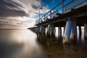 Beautiful long exposure seascape with wooden pier