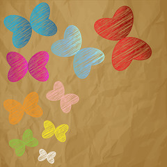 color butterflies scribble on a crumpled paper brown background