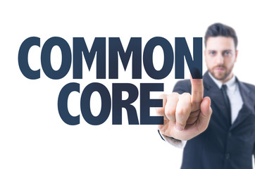 Business man pointing the text: Common Core