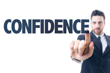 Business man pointing the text: Confidence