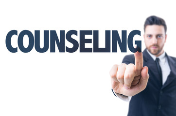 Business man pointing the text: Counseling