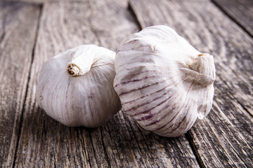 Garlic on a wooden background.