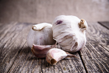 Garlic on a wooden background.