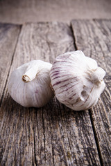 Garlic on a wooden background.