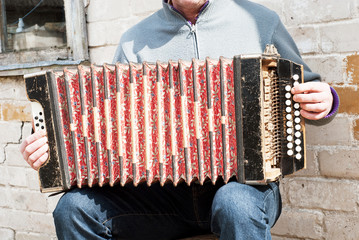 man playing concertina