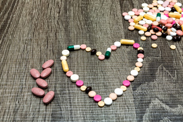 colorful pills in the shape of the heart