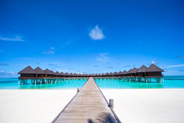 Water bungalows and wooden jetty on Maldives