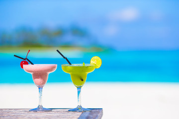 Two tasty cocktails on tropical white beach