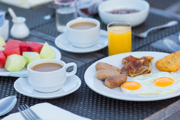 Fototapeta na wymiar Healthy breakfast on the table closeup in outdoor cafe