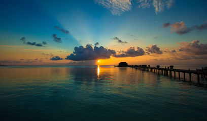 Fototapeta na wymiar Beautiful colorful sunset in tropical island at Maldives