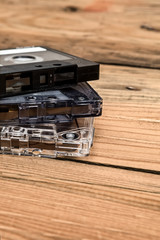 Vintage audio cassette with loose tape shaping two hearts on a w