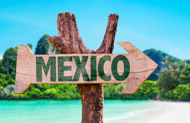 Mexico wooden sign with beach background