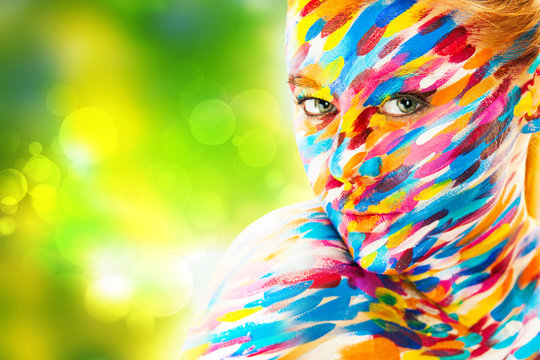 Portrait of the bright beautiful girl with art colorful make-up