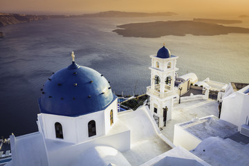 Sunset view of Santorini blue dome churches, Greece