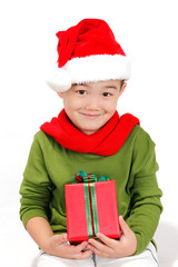 Smiling little boy with Christmas gift box