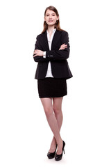 Fototapeta premium Attractive businesswoman standing arms crossed - Stock image