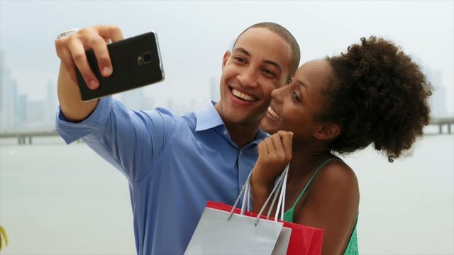 African American Couple Shopping Taking Selfie With Mobile Phone