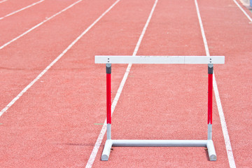 hurdles on the red running track