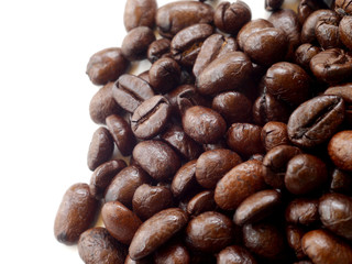 Brown coffee beans isolated on white background