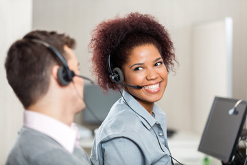 Customer Service Representatives Talking In Call Center