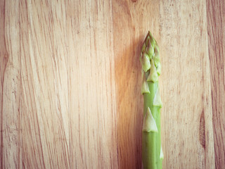 asparagus on wooden table with filter effect retro vintage style