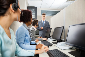 Confident Manager In Discussion With Customer Service Representa