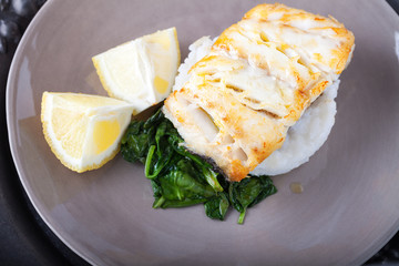Fried cod fillets and spinach