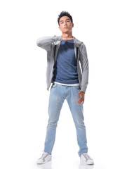 Full length Young man in jeans standing posing 