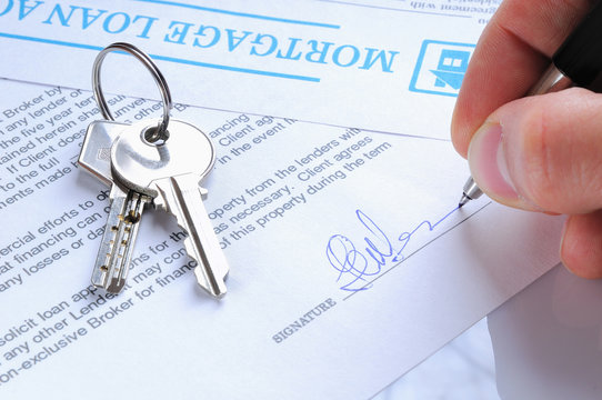 Client Signing A Mortgage Loan Agreement