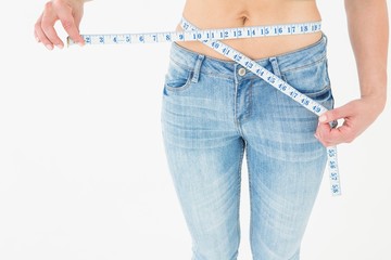 Woman measuring her waist