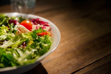 Healthy salad and glass of water