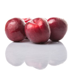 Victoria plum or red plum over white background