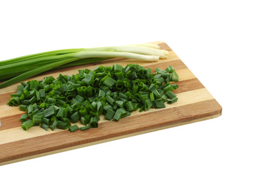 green onion on the board isolated