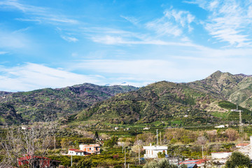 Fototapeta na wymiar suburb of town Gaggi in green hills, Sicily, Italy