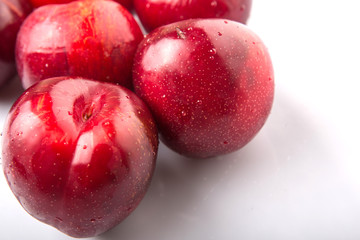 Victoria plum or red plum over white background