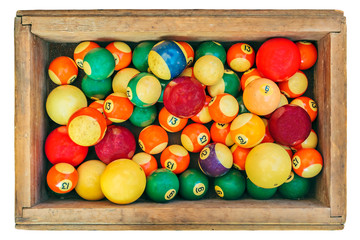 Ancient pool billiard balls in a wooden box