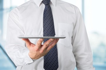 Analyzing. Touch screen ,touch- tablet in hands