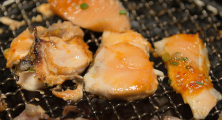 Korean style grilled fish and meat on hot stove  closeup