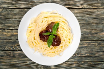 Background. Pasta with meatballs and parsley with tomato sauce