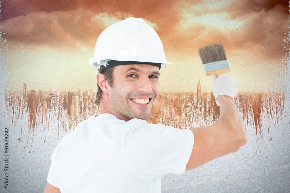 Aufkleber Composite image of portrait of happy man using paintbrush