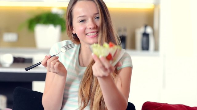 Healthy Smiling Teenage Girl Eating Vegetable Salad