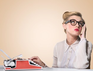 Journalist. Beautiful journalist looks typewriter