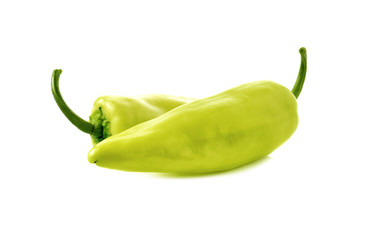 green chili peppers with stem on white background