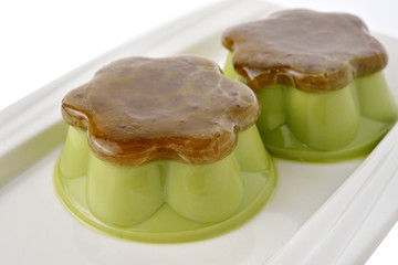 Matcha green tea custard with sweet minced red bean on plate